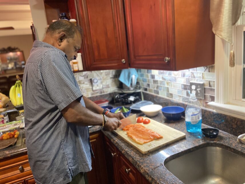 Saddan cubes salmon for his Jaffna-style meen kulambu (fish curry).